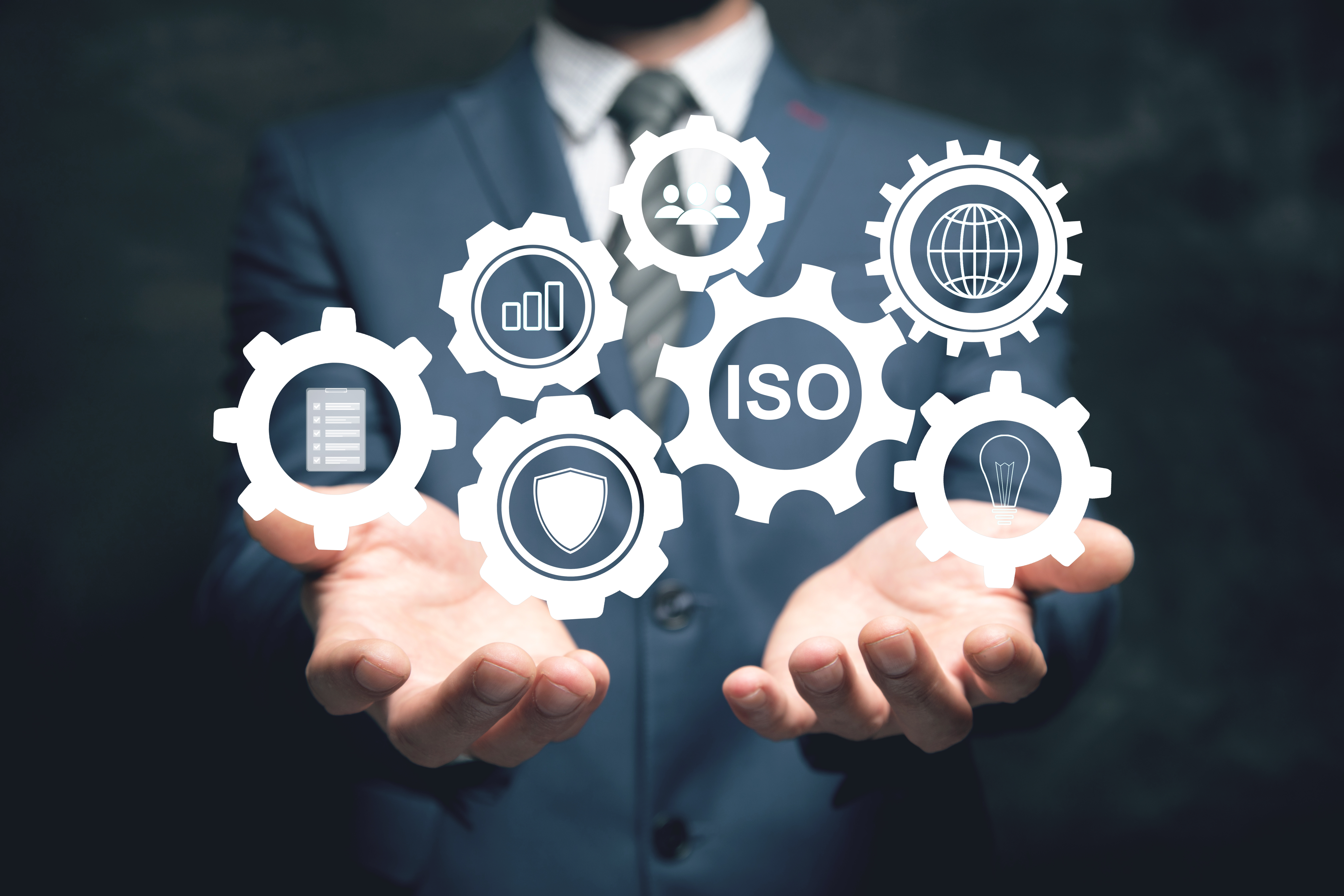 ISO and gear icons. Working mechanism. Man holding in his hand